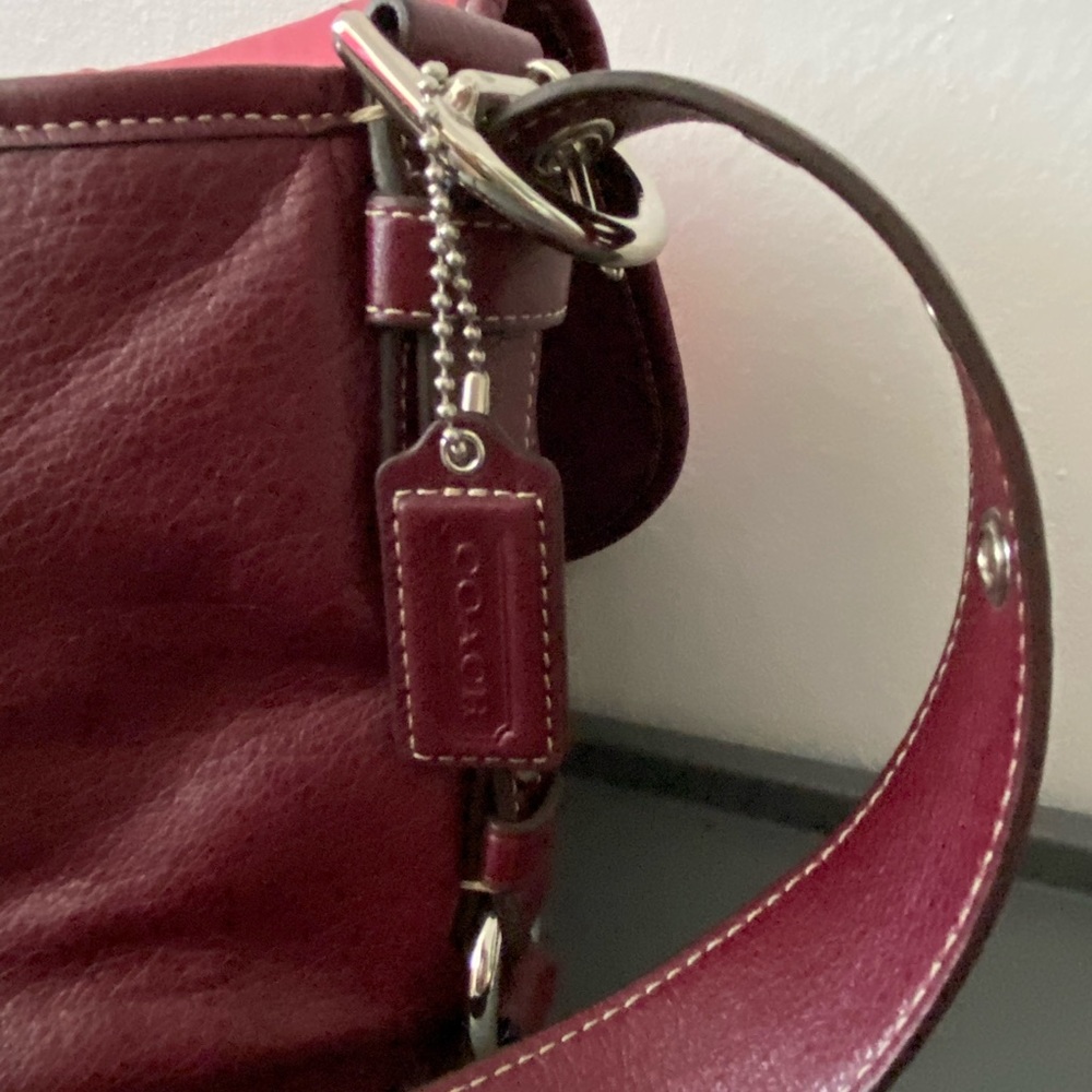 Coach maroon/wine leather purse.